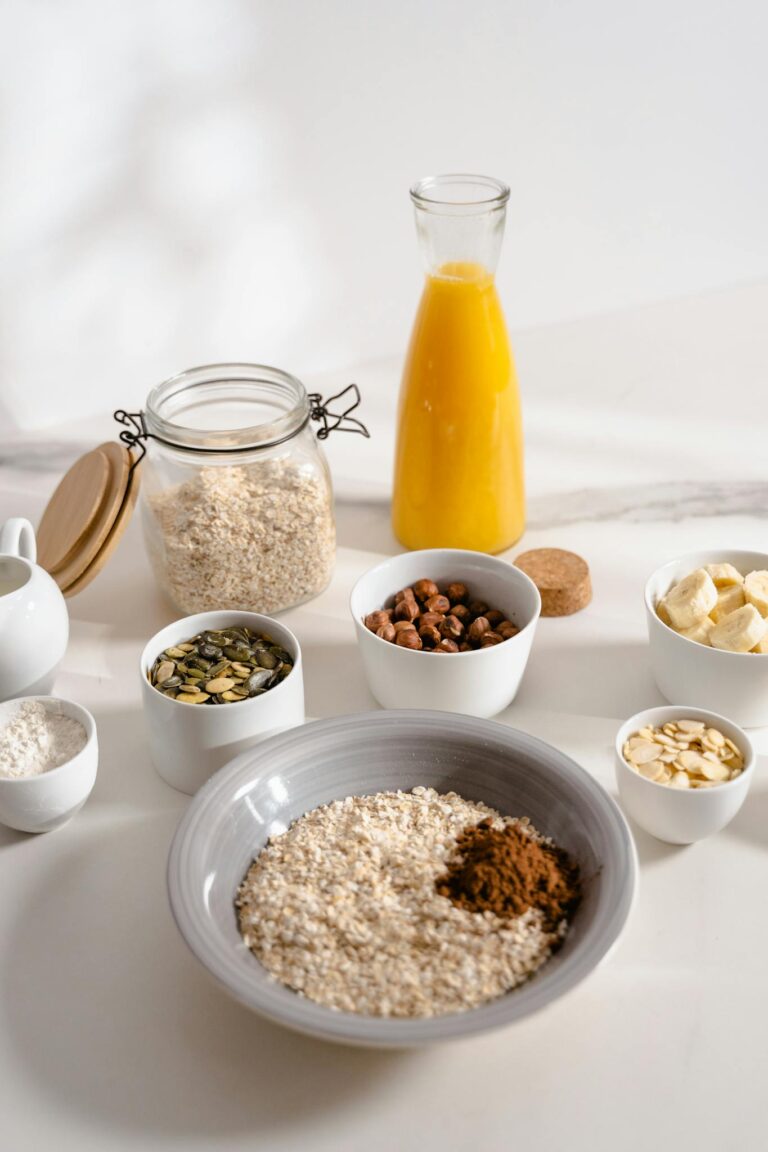 A nutritious breakfast setup with oats, nuts, and orange juice for a wholesome start.